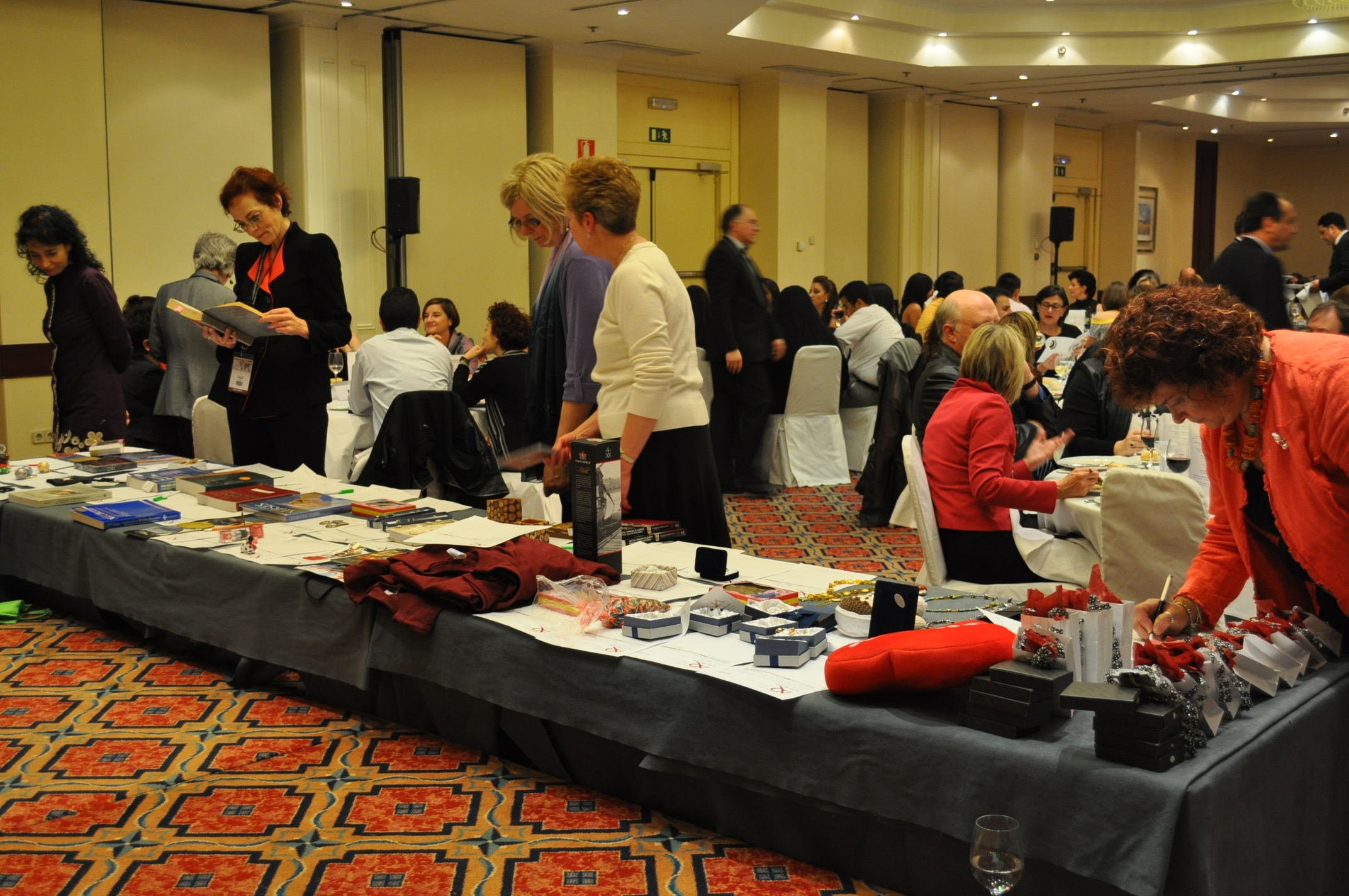 conference attendees exploring the merchandise table