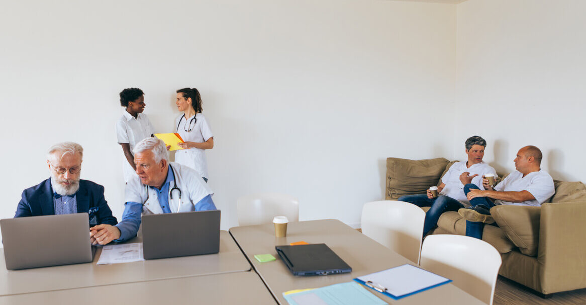 group of medical professionals sitting around a room