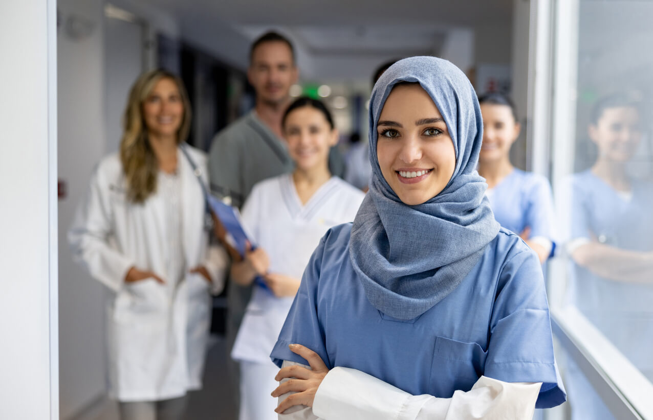 Iranian nurse in the foreground with group behind her