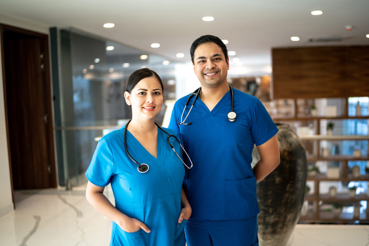 Two smiling nurses