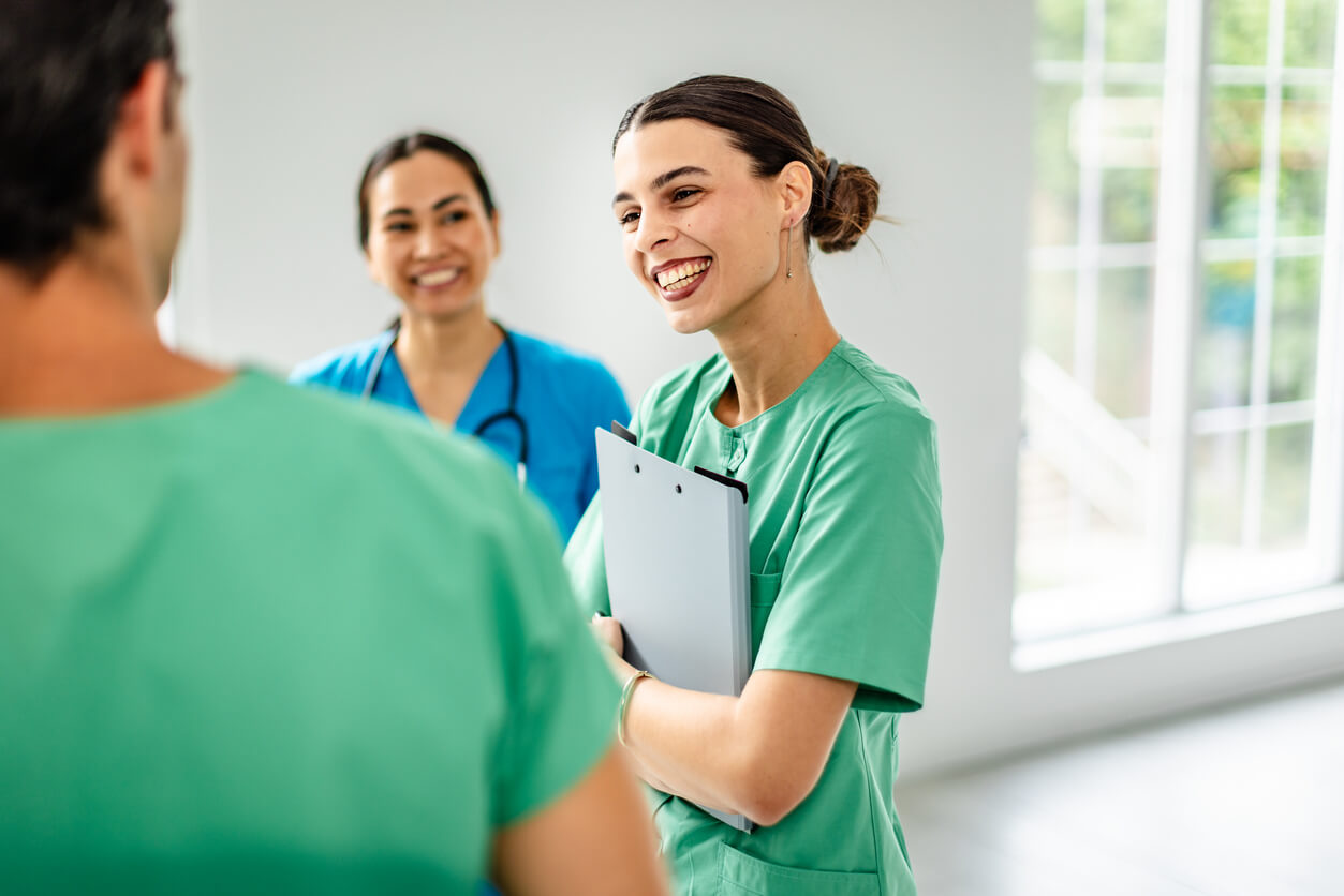 Friendly nurses interacting with each other