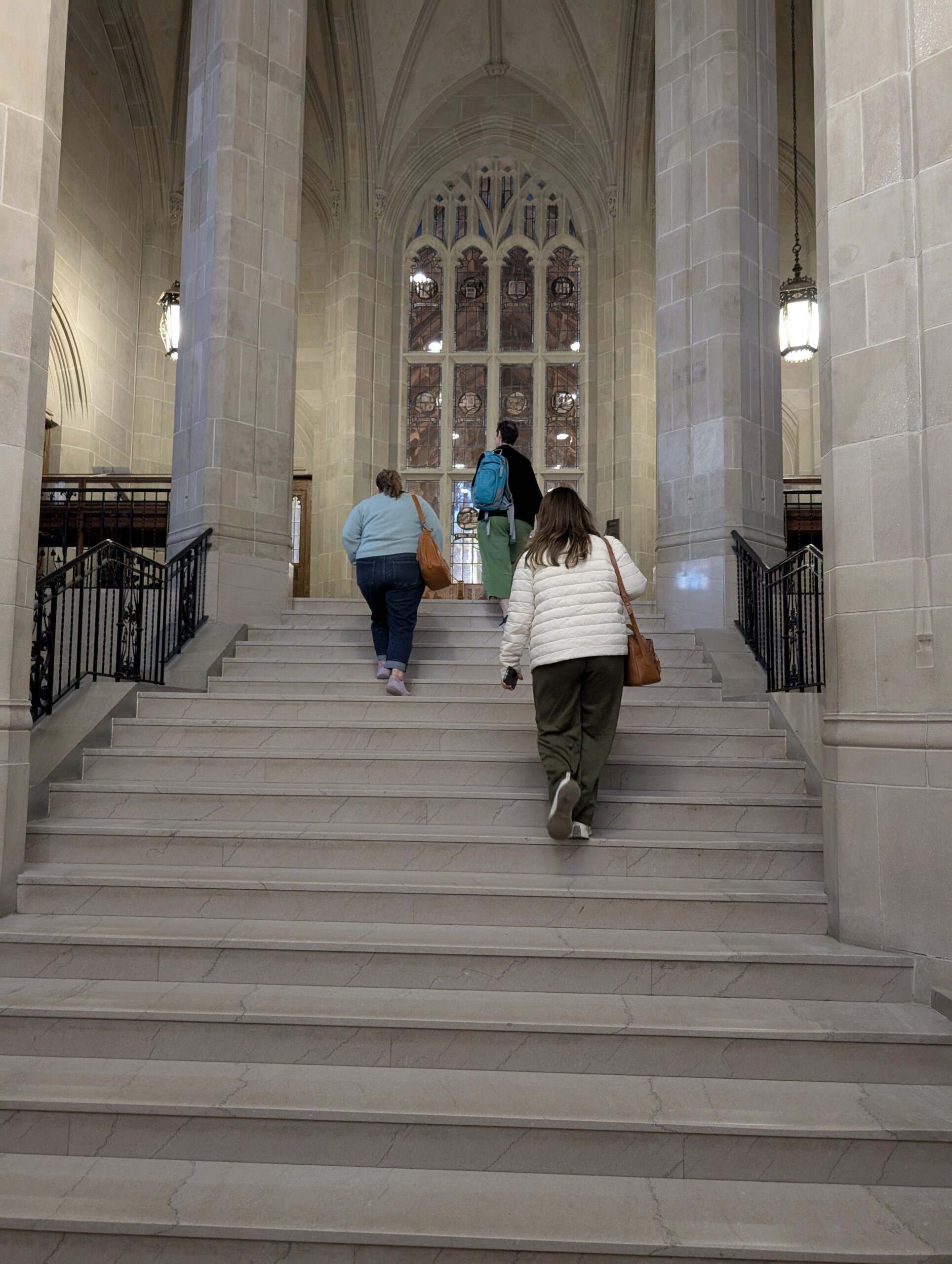 INKA team walking up stairs to Boston College library
