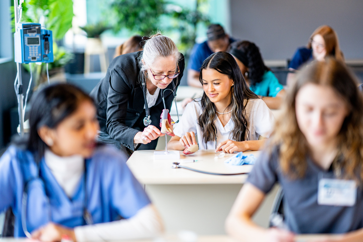 nursing students learning from teacher