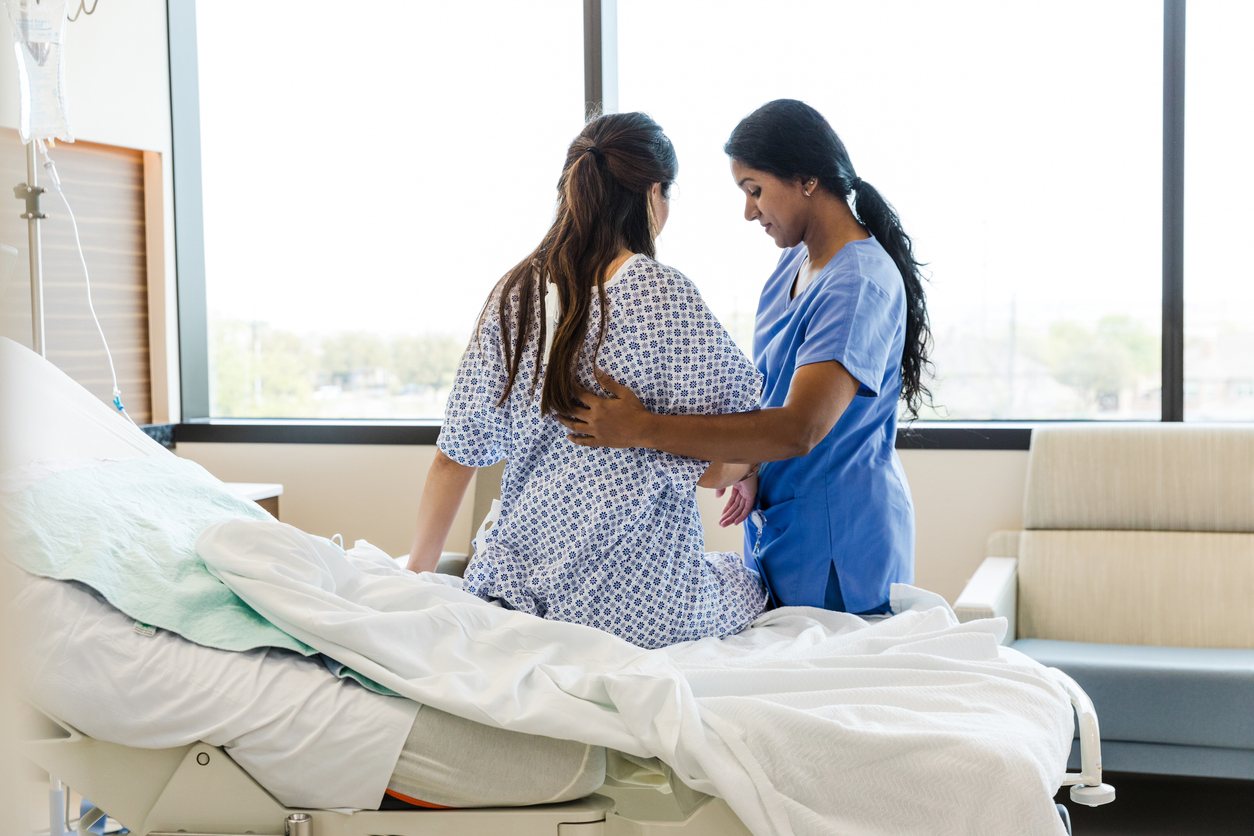 nurse helping patient